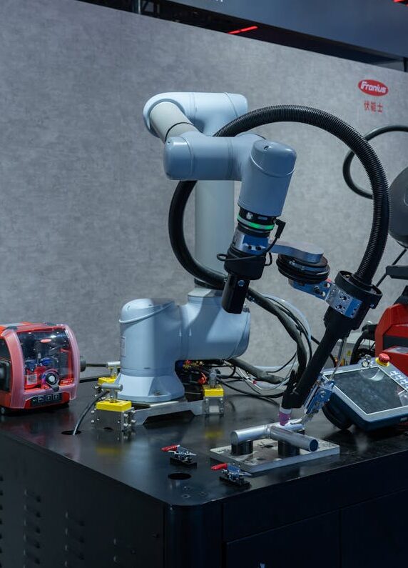 Advanced robotic welding station showcasing modern automation technology in an industrial setting.